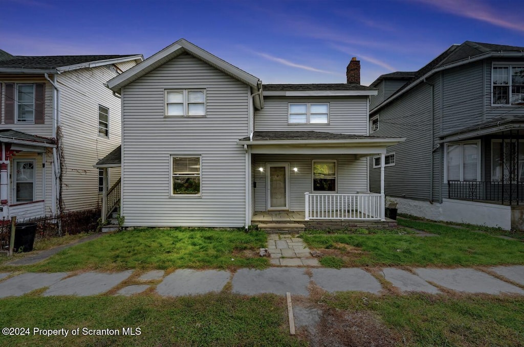 front facade with a porch