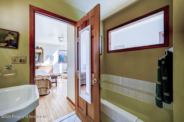 3171 State Route 247, Clifford Twp, PA 18407 - bathroom featuring a sink, ensuite bathroom, a bath, and a ceiling fan