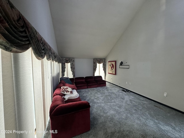 living room with carpet and vaulted ceiling