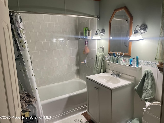 bathroom featuring shower / bathtub combination with curtain and vanity