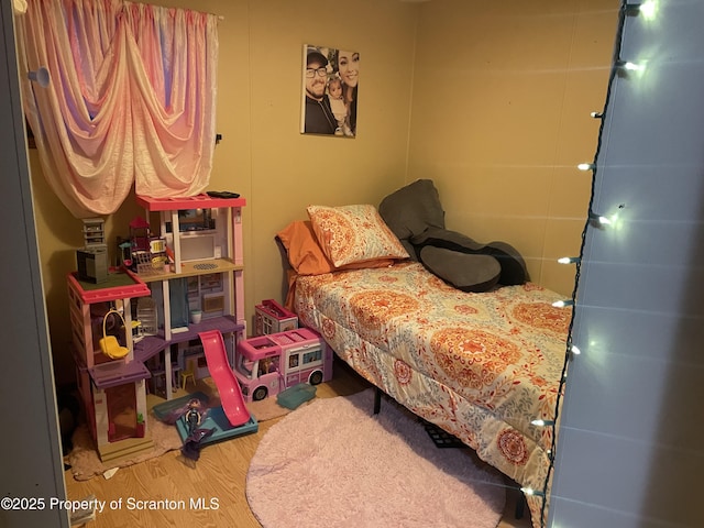 bedroom featuring hardwood / wood-style floors