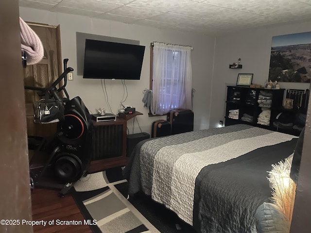 bedroom featuring hardwood / wood-style floors