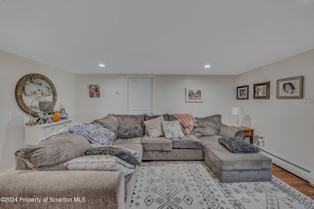 living room featuring light hardwood / wood-style floors and baseboard heating