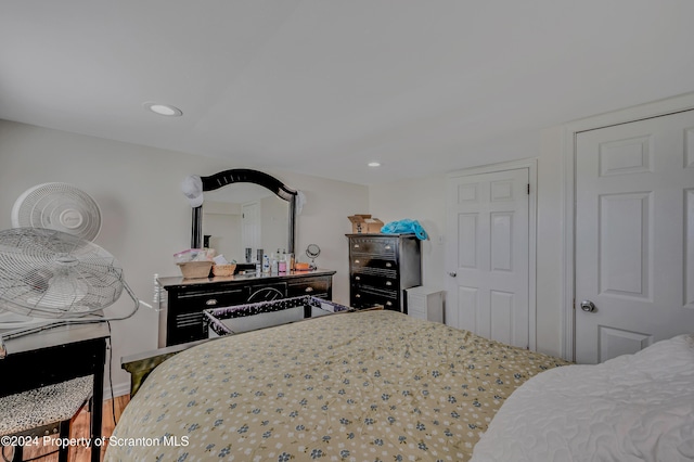 bedroom with hardwood / wood-style flooring