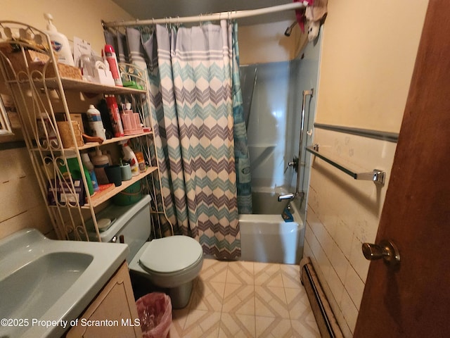 bathroom featuring vanity, toilet, shower / bath combo, and baseboard heating