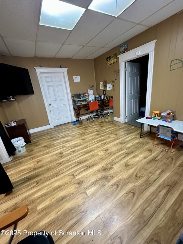 office space with wood-type flooring and a drop ceiling