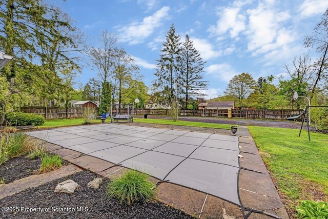 view of pool featuring a playground