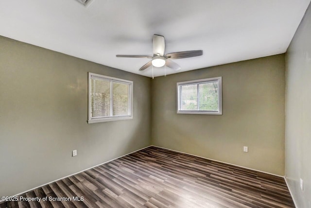 unfurnished room featuring a ceiling fan and wood finished floors