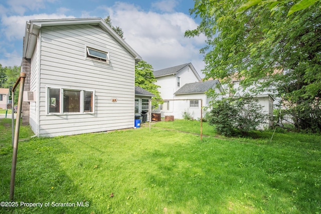 517 Emmett St, Scranton, PA 18505 - rear view of property with a lawn