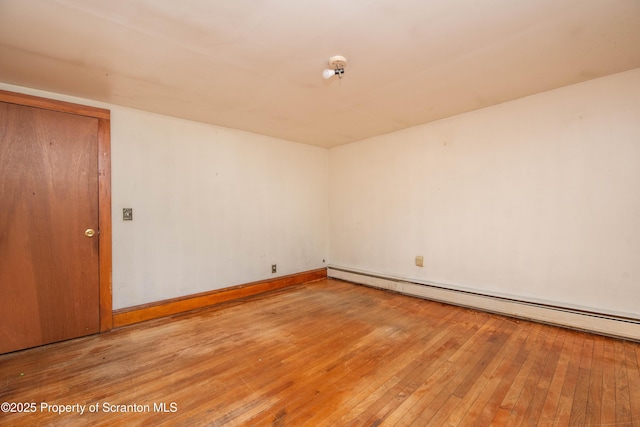 517 Emmett St, Scranton, PA 18505 - unfurnished room featuring a baseboard heating unit and hardwood / wood-style flooring