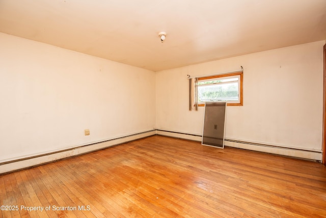 517 Emmett St, Scranton, PA 18505 - empty room featuring light wood-style flooring, a baseboard heating unit, and a baseboard radiator