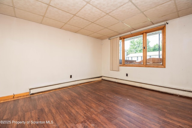 517 Emmett St, Scranton, PA 18505 - spare room with a drop ceiling, wood finished floors, and baseboard heating