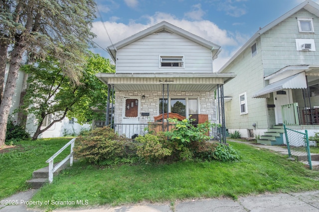 517 Emmett St, Scranton, PA 18505 - view of front facade featuring a porch, stone siding, and a front yard