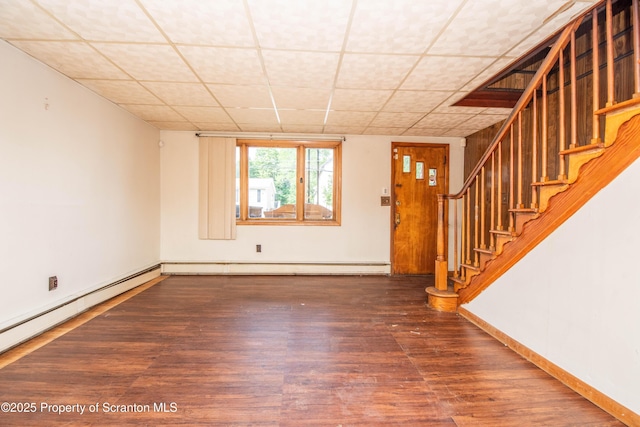 517 Emmett St, Scranton, PA 18505 - entryway with a paneled ceiling, stairs, wood finished floors, and a baseboard radiator