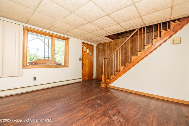 517 Emmett St, Scranton, PA 18505 - foyer with a baseboard heating unit, wood finished floors, stairway, and a paneled ceiling