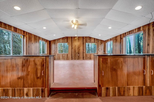 kitchen with plenty of natural light, ceiling fan, and vaulted ceiling