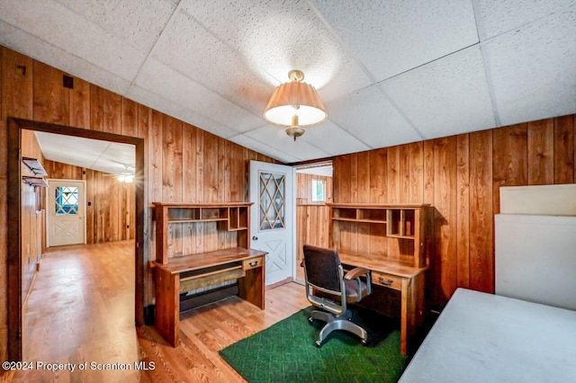 office area featuring a paneled ceiling, ceiling fan, hardwood / wood-style floors, and lofted ceiling