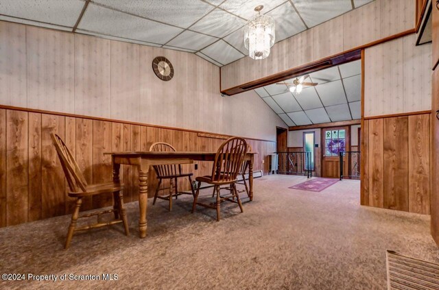 living area featuring carpet flooring, ceiling fan, lofted ceiling, and baseboard heating