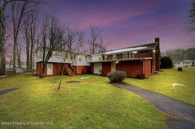 view of front of home with a yard