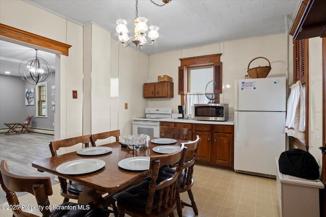 126 Crown Ave, Scranton, PA 18505 - dining area featuring a chandelier, a baseboard heating unit, and light floors