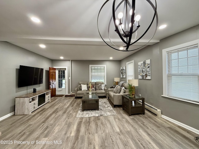 126 Crown Ave, Scranton, PA 18505 - living room with a chandelier, light wood-style floors, baseboard heating, and recessed lighting