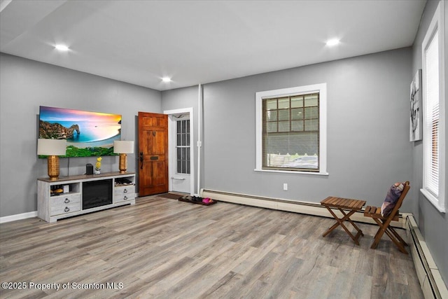 126 Crown Ave, Scranton, PA 18505 - living room with wood finished floors, a baseboard radiator, and recessed lighting