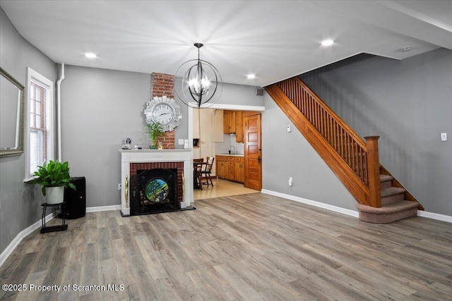 126 Crown Ave, Scranton, PA 18505 - unfurnished living room with stairs, wood finished floors, a chandelier, and recessed lighting