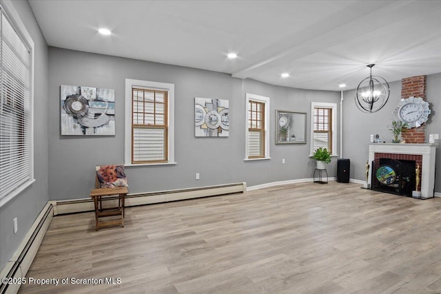 126 Crown Ave, Scranton, PA 18505 - living area with baseboard heating, light wood-style flooring, recessed lighting, a chandelier, and healthy amount of natural light