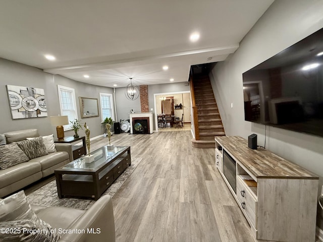 126 Crown Ave, Scranton, PA 18505 - living area with light wood-type flooring, recessed lighting, stairs, and a brick fireplace