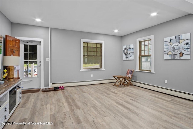 126 Crown Ave, Scranton, PA 18505 - playroom with wood finished floors, a baseboard heating unit, and recessed lighting