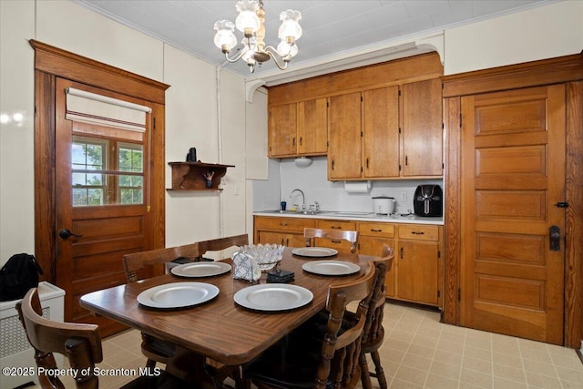 126 Crown Ave, Scranton, PA 18505 - dining room featuring a chandelier and ornamental molding