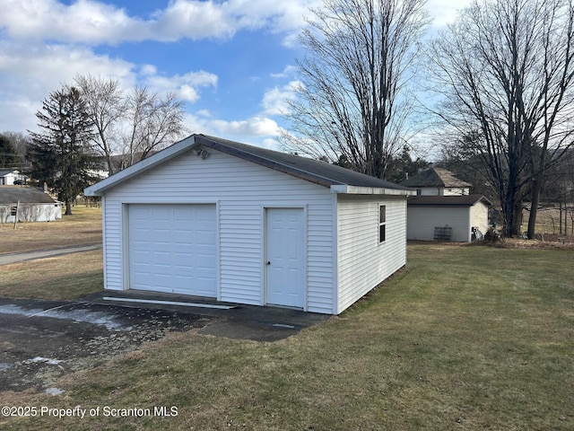 garage with a yard