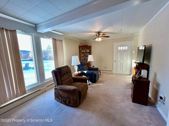 sitting room featuring a baseboard heating unit, ornamental molding, and carpet flooring