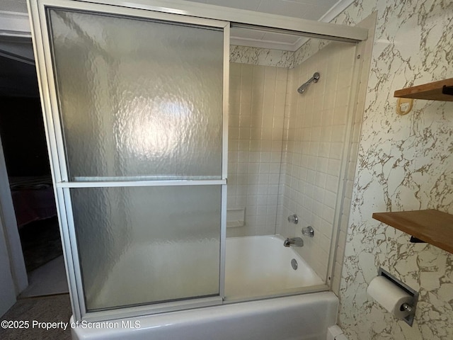 bathroom with shower / bath combination with glass door