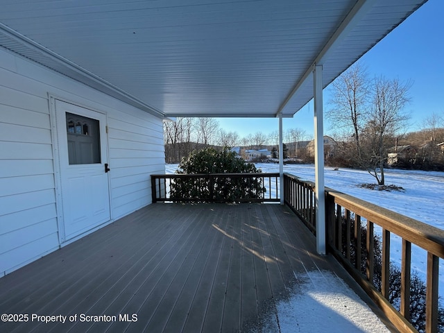 view of snow covered deck