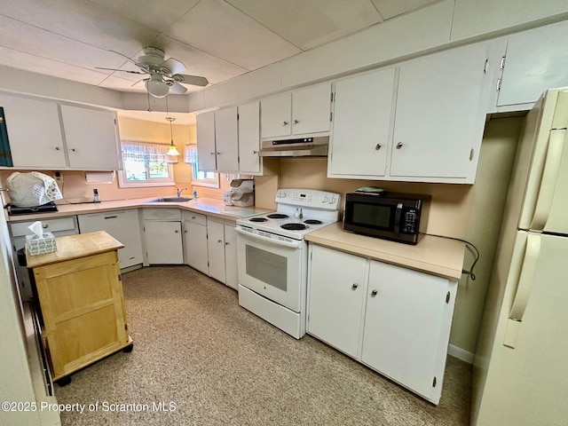 kitchen featuring white appliances, sink, and white cabinets