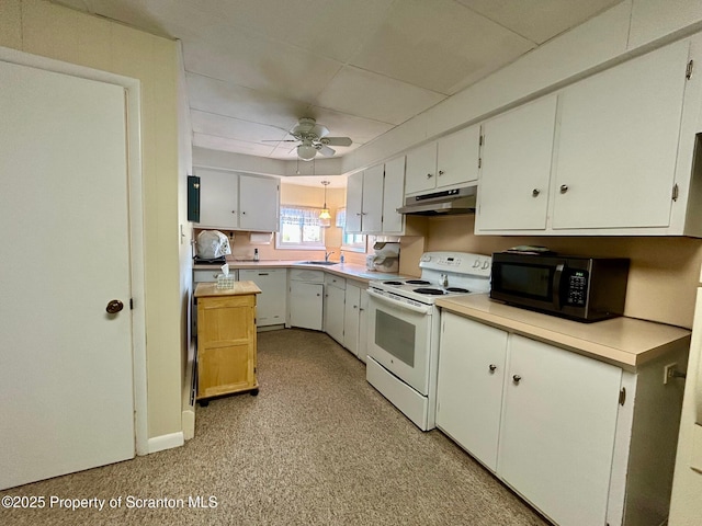 kitchen with sink, white appliances, white cabinets, and ceiling fan