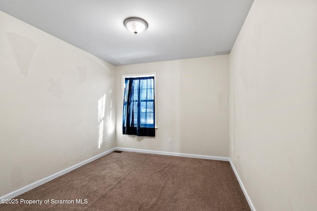 unfurnished room with carpet flooring