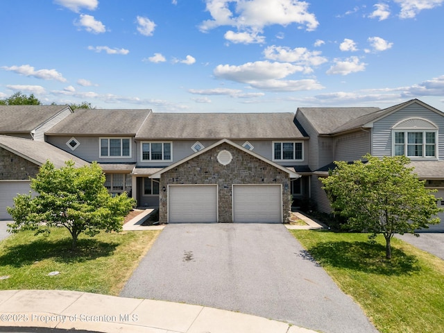 view of property featuring a front lawn