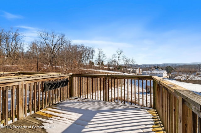 view of snow covered deck