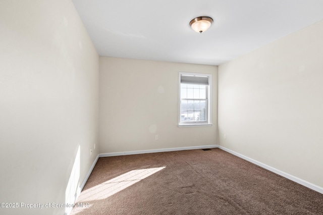 spare room featuring carpet flooring