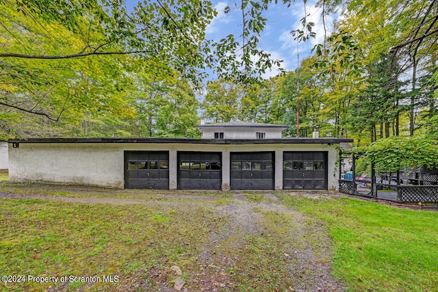 garage with a lawn