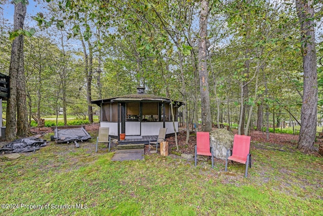 view of yard with a sunroom