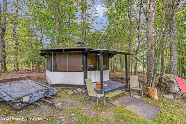 exterior space featuring a sunroom