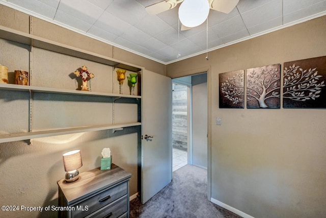 corridor with carpet flooring and crown molding