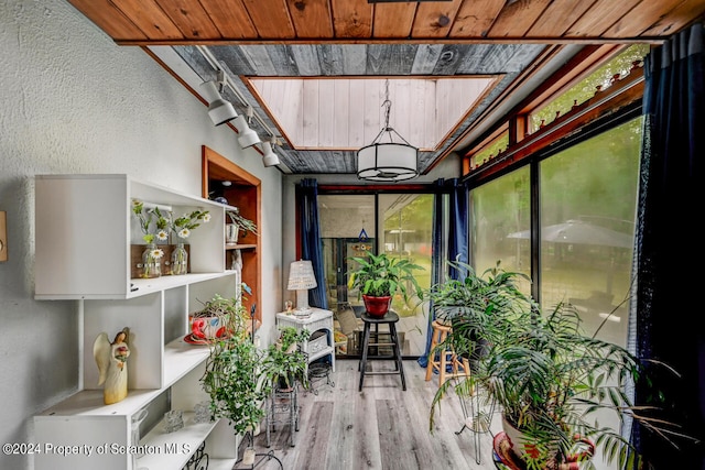 sunroom featuring wooden ceiling