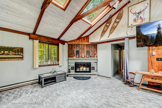 carpeted living room featuring beamed ceiling, a skylight, a wealth of natural light, and wood walls