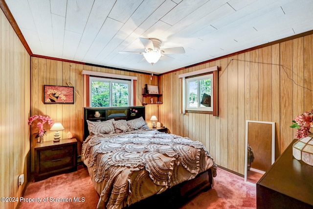 bedroom with multiple windows, ceiling fan, and carpet