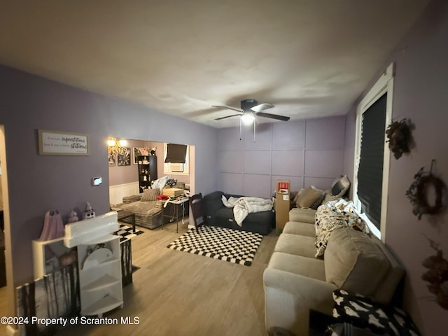 bedroom with light wood-type flooring and ceiling fan