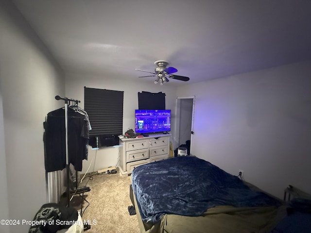 bedroom featuring ceiling fan and carpet floors